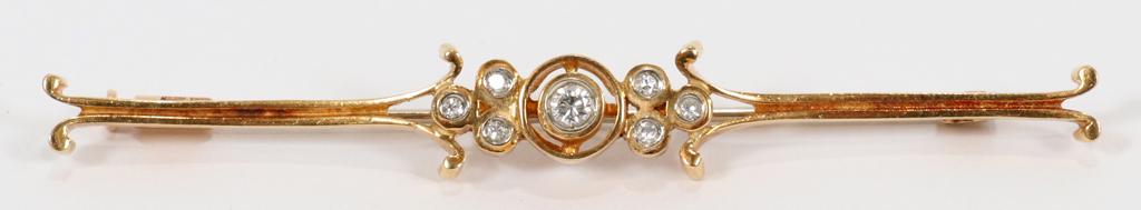 14KT YELLOW GOLD & DIAMOND BAR PIN, C.1900: 14KT YELLOW GOLD & DIAMOND BAR PIN, C.1900. TW. 5.6 GR. Oblong gold with diamonds and gold with coral. Length 2 5/8", Total weight 5.6 grams. Having one brilliant cut diamond approx. 0.10ct. and six s