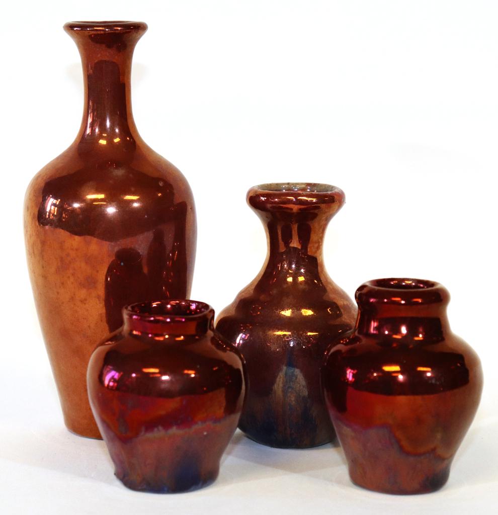 IRA & ELLA PETERS, PEWABIC POTTERY RED GLAZE VASES: IRA & ELLA PETERS, PEWABIC POTTERY RED GLAZE VASES, 4 PCS, H 2"-6"Includes: 2 Ira and Ella vases, 2.5" and 2.7" and 2 unsigned, 3.7" and 6". From the collection of Robert Schweizer, Ann Arbor, MI.