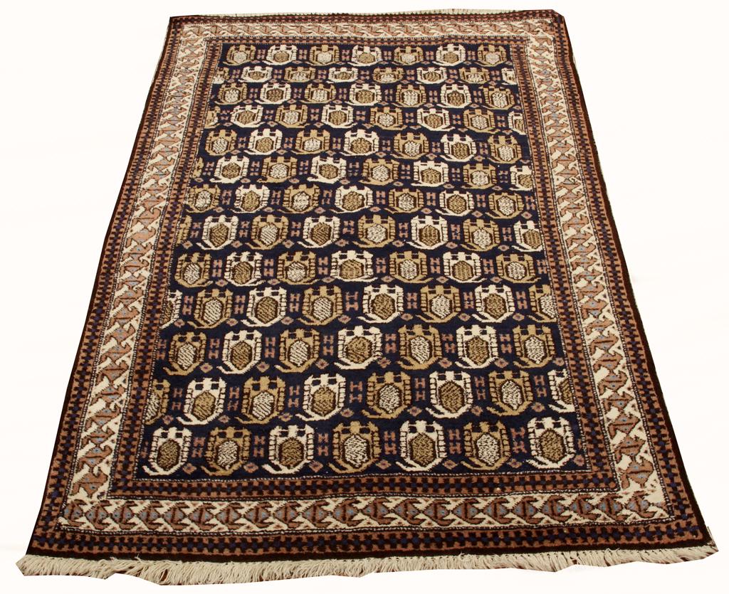 HAND WOVEN DAGISTAN WOOL RUG C. 1900: HAND WOVEN DAGISTAN WOOL RUG C. 1900 W 43.5" L 61.5" Blue field, beige and tan. Having a central elephant print pattern.