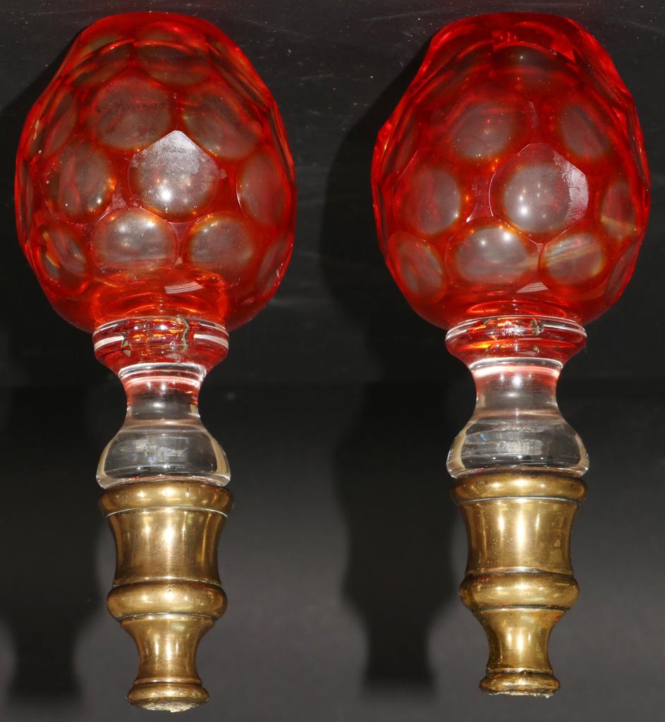 NEWELL POSTS, OVERLAY CRYSTAL, 2 PCS, L 8": NEWELL POSTS, OVERLAY CRYSTAL, 2 PCS, L 8" Oval sphere, orange crystal cut to clear, on a brass fitting. Property of Robert Schweizer, Ann Arbor.