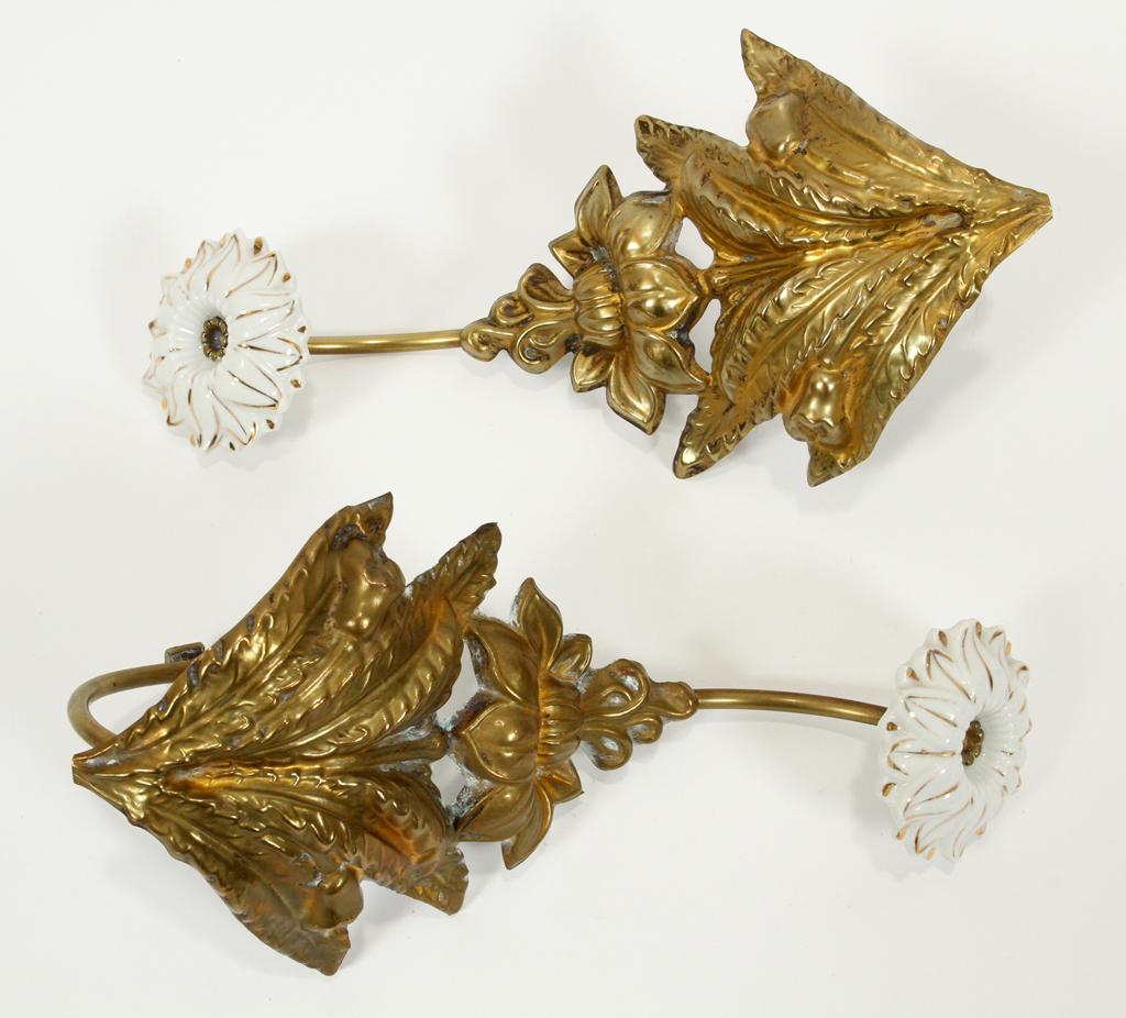 PUNCHED BRASS WALL ORNAMENTS, C. 1910, 2 PCS: PUNCHED BRASS WALL ORNAMENTS, C. 1910, 2 PCS, H 10", W 5" Porcelain flower form terminals. Property of Robert Schweizer, Ann Arbor.