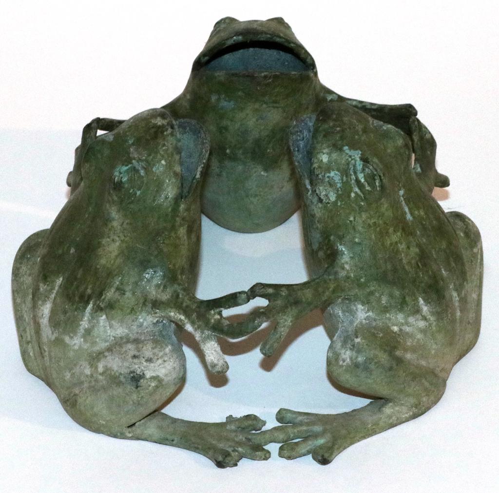 BRONZE FROGS, GARDEN ORNAMENT H 4", DIA 7": BRONZE FROGS, GARDEN ORNAMENT H 4", DIA 7" Three frogs holding hands. Property of Robert Schweizer, Ann Arbor.