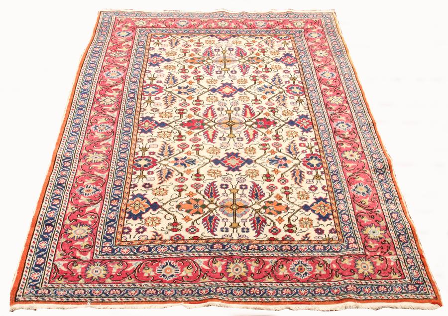 TURKISH ANTIQUE ORIENTAL RUG C1930: TURKISH ANTIQUE ORIENTAL RUG C1930, W 4', L 5' 8" Having an ivory ground, with seven borders with the primary border in red and having alternating blue and yellow flowers and vine designs. The field h