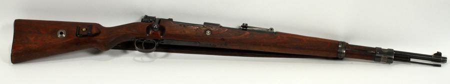 MAUSER MODEL K98 BOLT-ACTION RIFLE 8MM, C1940: MAUSER MODEL K98, BOLT-ACTION RIFLE, 8MM, C1940, L 23", 43 1/2" (O/A), #3988 Having a full-length walnut stock and shoulder strap, 23" barrel, blued finish, bolt action, adjustable rear sight, cleanin