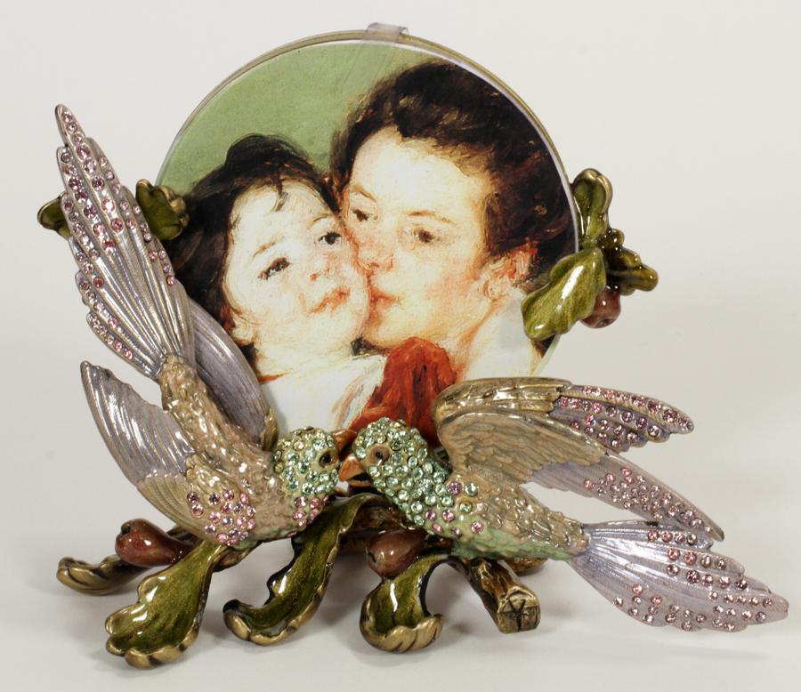 JAY STRONGWATER ENAMEL PICTURE FRAME, H 4", W 6": JAY STRONGWATER ENAMEL PICTURE FRAME, H 4", W 6" A Jay Strongwater enamel and bejeweled picture frame. Having a lovebird motif with original tag.