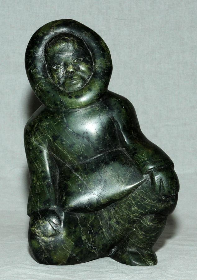 CANADIAN INUIT, STONE SCULPTURE, H 9", W 5.5": CANADIAN INUIT, STONE SCULPTURE, H 9", W 5.5" Canadian Inuit, stone sculpture, H 9", W 5.5", of a man in a crouching position. The sculpture is not signed.
