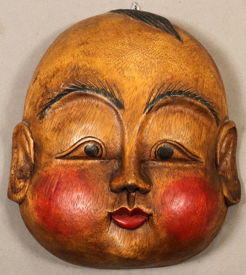 THAILAND WOOD MASK, H 9", W 8": THAILAND WOOD MASK, H 9", W 8"A Thailand wood mask with a round plump face with painted features. From the estate of Gerald Torrence, Chicago.
