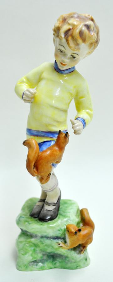 ROYAL WORCESTER, GLAZED PORCELAIN FIGURINE: ROYAL WORCESTER, GLAZED PORCELAIN FIGURINE, H 7", "OCTOBER" Depicts a child playing with a pair of squirrels. Royal Worcester mark, inscribed "Modeled by F.G. Doughty" and titled "October" on the unde