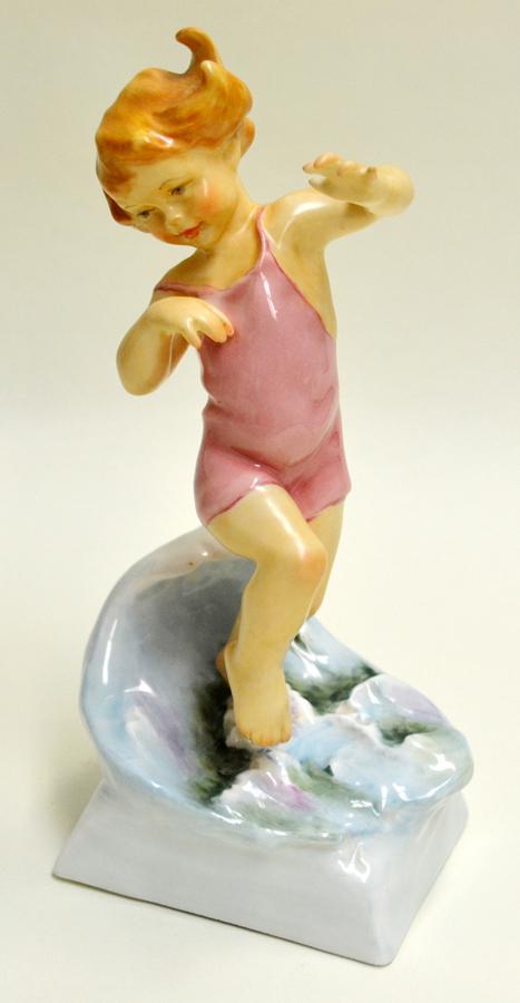 ROYAL WORCESTER, PORCELAIN FIGURINE, H 7", "JULY": ROYAL WORCESTER, PORCELAIN FIGURINE, H 7", "JULY" Depicts a little girl playing in the water. Royal Worcester mark, inscribed "Modeled by F.G. Doughty" and titled "July" on the underside.