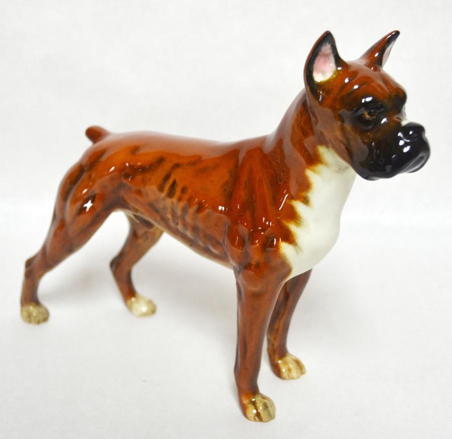 GOEBEL W. GERMANY, HAND PAINTED, PORCELAIN BOXER: GOEBEL W. GERMANY, HAND PAINTED, PORCELAIN BOXER, H 7", W 6 1/4"Depicts a boxer dog, brown in color white chest, black nose and edges of the ears. Marked 'Goebel W. Germany' and incised 'CH617' on the
