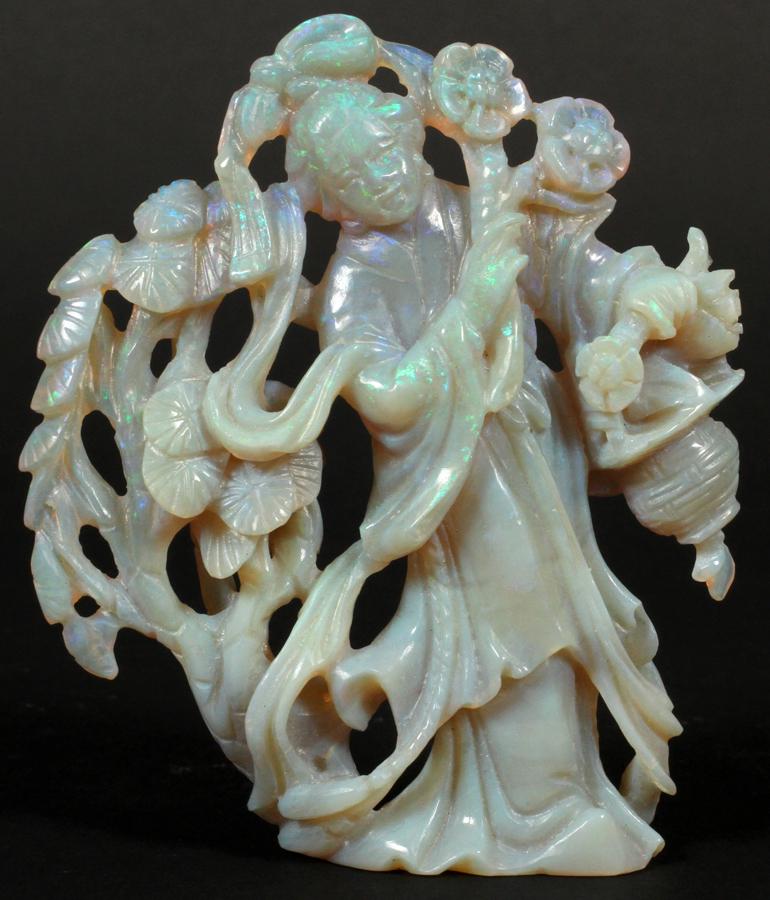254KT OPAL GUAN-YIN CARVING, H 3.5", W 3": 254KT OPAL GUAN-YIN CARVING, H 3.5", W 3", T.W. 52 GR An opal carving depicting Guan-Yin. 254 karats, weighing 52 grams. Accompanied by original box, measuring H 2" x W 4.5" x D 3", and appraisal from