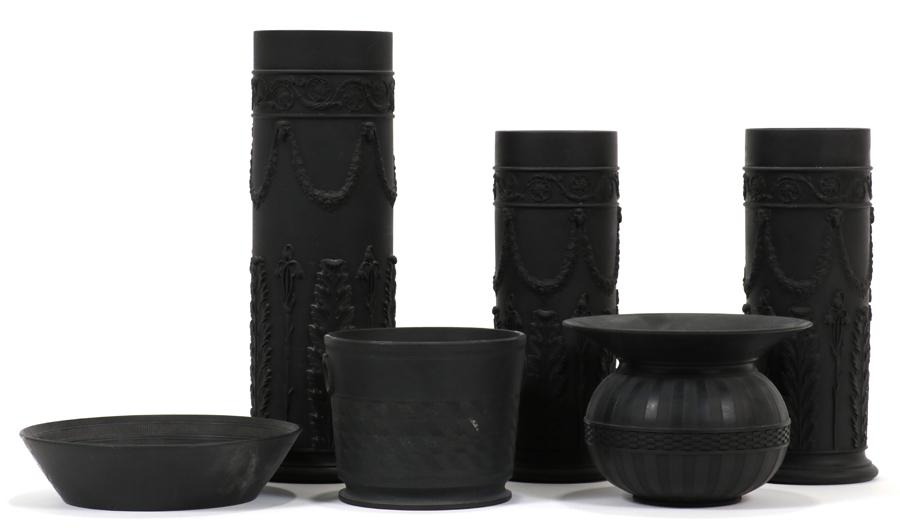 BLACK BASALT VASES, INCL. WEDGWOOD, 6 PCS: BLACK BASALT VASES, INCL. WEDGWOOD, 6 PCS, H 1.25"-9.75"Three impressed "Wedgwood". Three Adams style cylindrical vases, a cachepot, shallow dish and a flared vase. Property of the Arthur Schwartz Est
