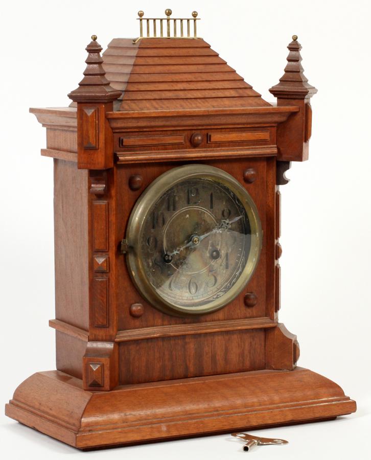 PHILLIP HAAS, GERMANY, WALNUT WOOD CASE CLOCK: PHILLIP HAAS, GERMANY, WALNUT WOOD CASE CLOCK, C. 1900, H 17", W 13" Markers logo: Phillip Haas & Sohne. Arabic numerals. Architectural case stepped roof. Corner pillars. Brass rim to glass door.