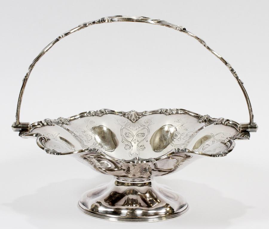 JAMES DIXON & SONS SILVER PLATE CAKE BASKET: JAMES DIXON & SONS SILVER PLATE CAKE BASKET, H 11", DIA 11.75"A James Dixon & Sons silver plate handled cake basket. Having a monogrammed handle. Signature branding to the underside.