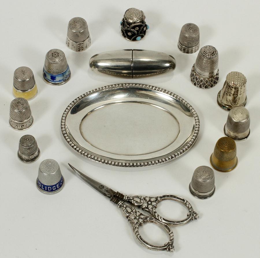 SEWING ARTICLES STERLING, ENAMEL, BRASS: SEWING ARTICLES STERLING, ENAMEL, BRASS, ALUMINUM THIMBLES, NECESSAIRE, SCISSORS, TRAY 16 A group of sewing articles. All are sterling with the exception of two thimbles. Some thimbles are augmented w
