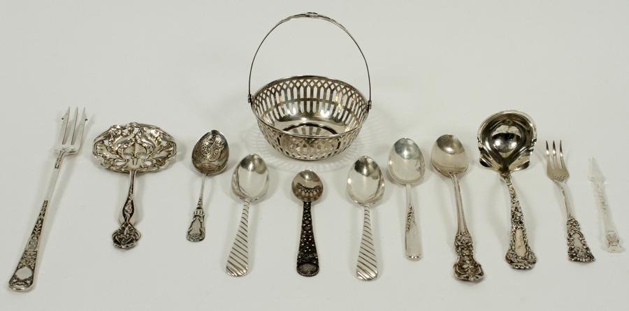 4. 16 TROY OZ. STERLING TABLE ARTICLES 12 L 7.75: 4. 16 TROY OZ. STERLING TABLE ARTICLES 12 L 7.75 Comprised of a Wallace sterling pierced basket, a nut spoon, six spoons, a ladle, two forks, and a pick. The nut spoon is in the form of an Iris. The l