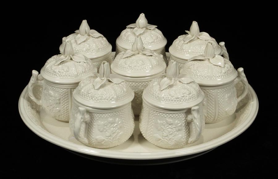 MOTTAHEDEH POT DE CREME & PLATTER SET, 9 PCS: MOTTAHEDEH POT DE CREME & PLATTER SET, 9 PCS A set of vintage Mottahedeh lidded pot de cremes and platter. Each bearing signature branding to the underside.