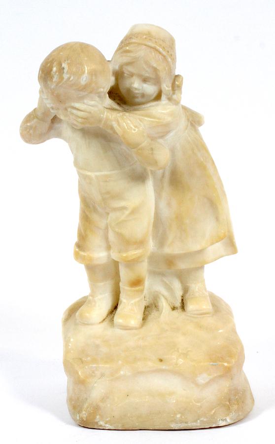 ITALIAN MARBLE SCULPTURE, H 8", CHILDREN AT PLAY: ITALIAN MARBLE SCULPTURE, H 8", CHILDREN AT PLAY Depicts two children with the young girl standing behind the boy with her hands over his eyes. Inscribed on the back of the base: "Made In Italy" and s