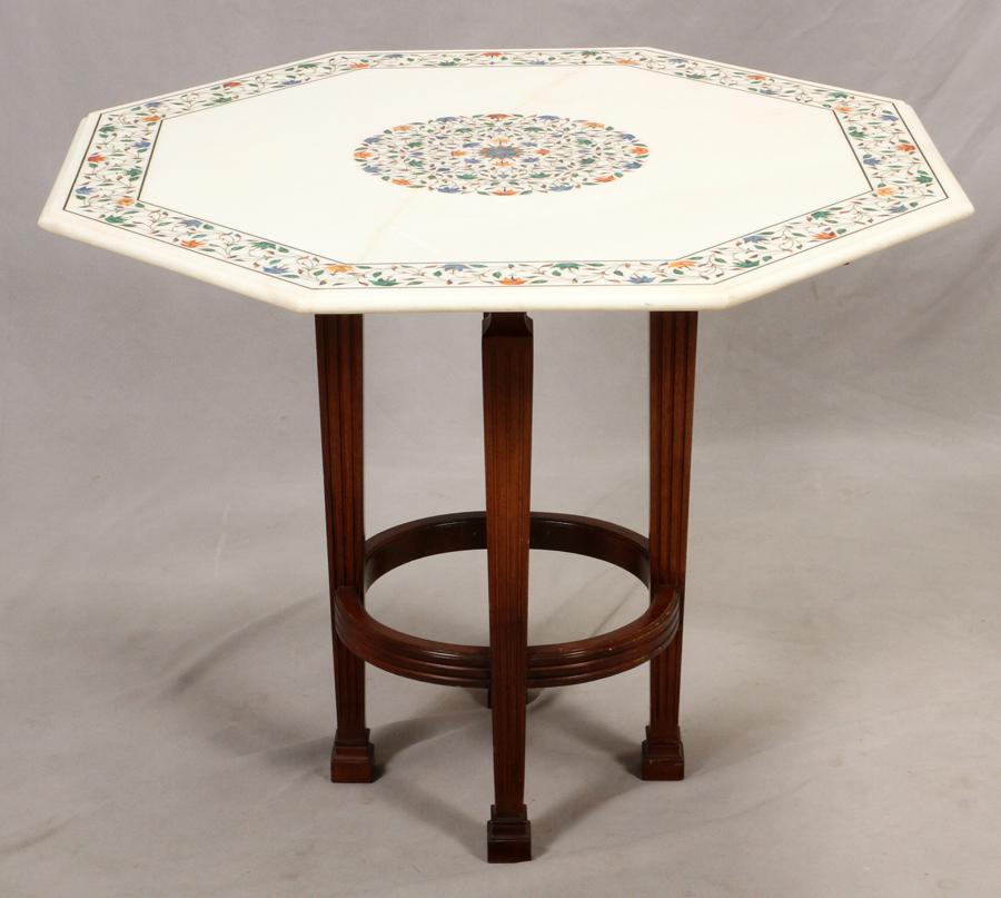 PIETRA DURA INLAID OCTAGONAL TOP, H 29", DIA 35 3/4": PIETRA DURA INLAID OCTAGONAL TOP, H 29", DIA 35 3/4" Whitestone top with lapis malachite. Carnelian floral inlays. On a wood base, four square, tapered and fluted legs, with a round fluted stretcher.