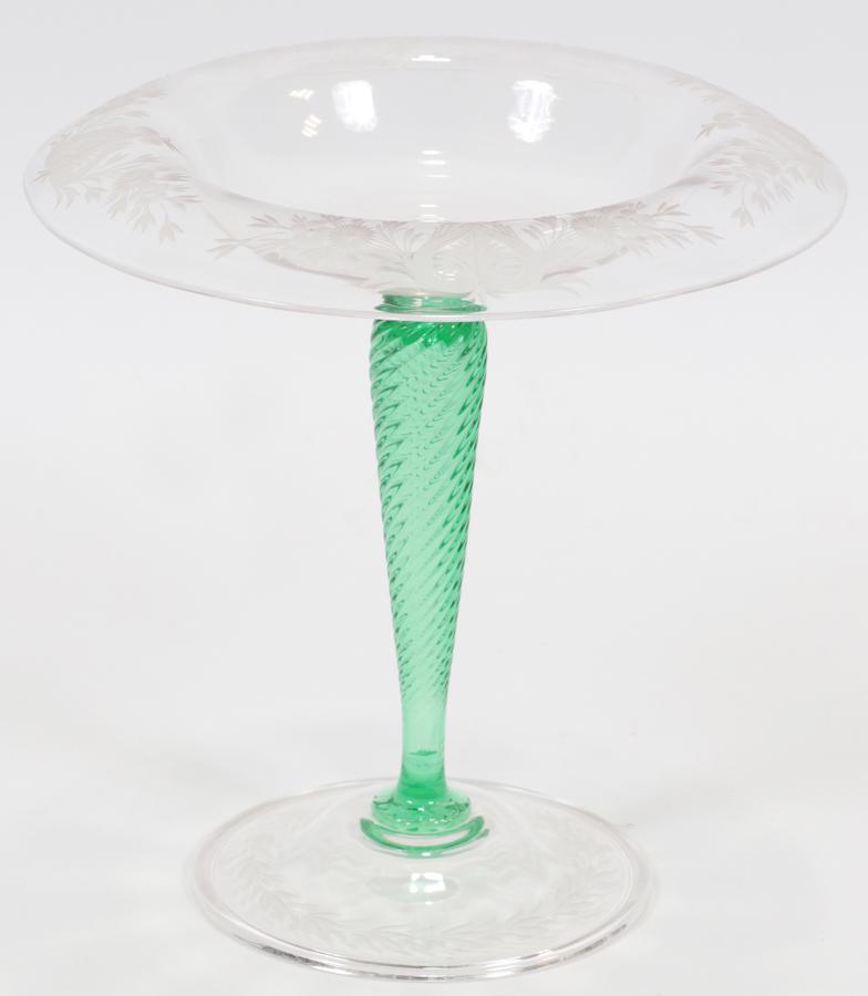 STEUBEN BLOWN AND ETCHED GLASS COMPOTE, GREEN STEM: STEUBEN BLOWN AND ETCHED GLASS COMPOTE, GREEN STEM C. 1920 H 8.75", DIA 8.5" Green spiral stem. Signed.