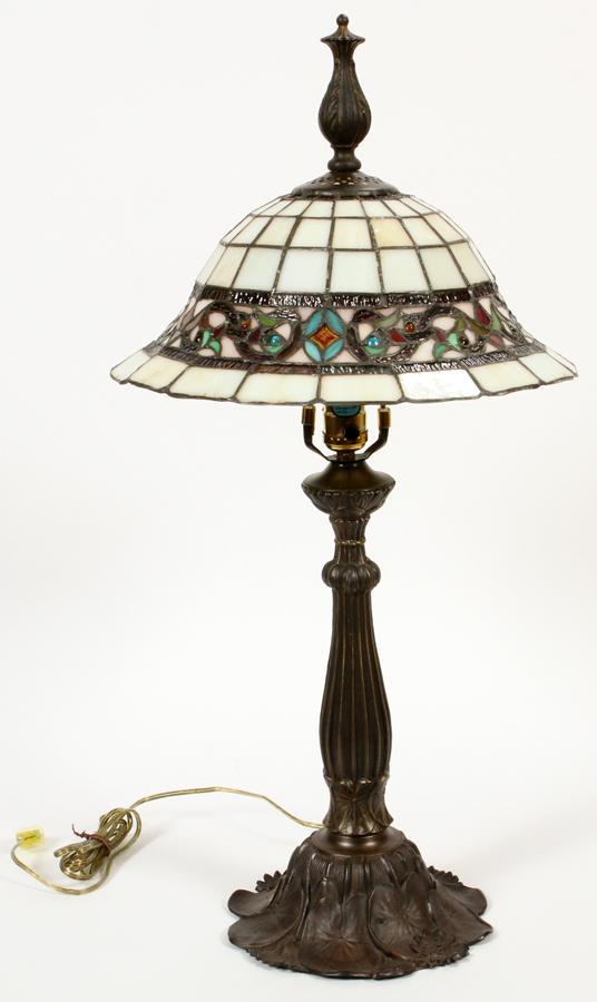 LEADED GLASS & PATINATED METAL TABLE LAMP: LEADED GLASS & PATINATED METAL TABLE LAMP, H 29", DIA 14 1/2" Having scrolling leaf band on patinated base. Electrified.