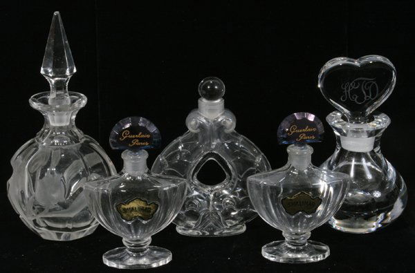 GUERLAIN LUBIN & ORREFORS GLASS BOTTLES, FIVE: GUERLAIN, LUBIN & ORREFORS GLASS PERFUME BOTTLES, FIVE, H 4"-6 1/2":Including 2 "Guerlain Paris" perfume bottles, 1 Orrefors perfume bottle with a monogrammed heart form stopper, 1 "Lubin Paris France