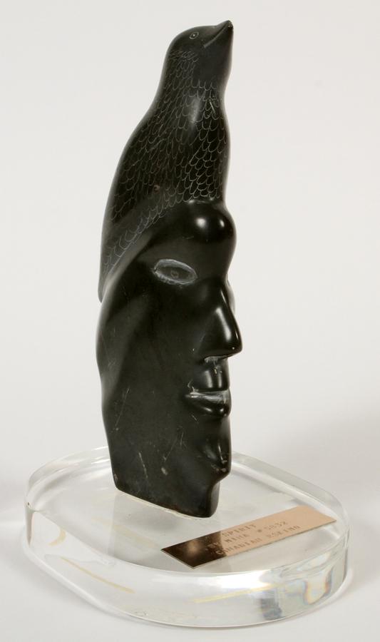 MINA (CANADIAN) SOAPSTONE SCULPTURE, "SPIRIT": MINA (CANADIAN) SOAPSTONE SCULPTURE, H 6", "SPIRIT" Canadian Eskimo head with bird titled "Spirit" by Mina #5832 with acrylic base. From the estate of Gerald Torrence, Chicago.