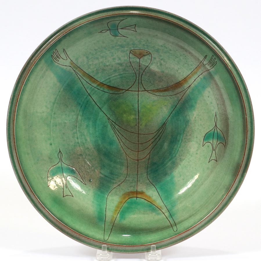 DANIEL RHODES (AMER, 1911-1989), CERAMIC BOWL: DANIEL RHODES (AMER, 1911-1989), CERAMIC BOWL, H 2.5", DIA 11.25" A glazed ceramic bowl by Daniel Rhodes. Having hand-incised central figure and birds to the basin. Artist's signature to the underside