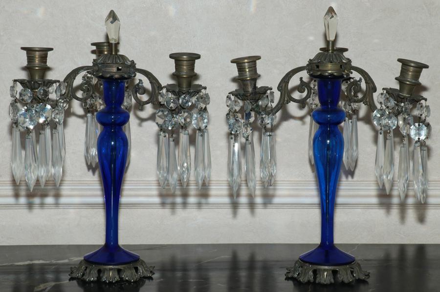COBALT GLASS & BRASS CANDELABRA, C. 1900, PAIR: COBALT GLASS & BRASS CANDELABRA, C. 1900, PAIR, H 14", W 10"A pair of cobalt glass and brass candelabra. Each having three arms with dangling crystal prisms.