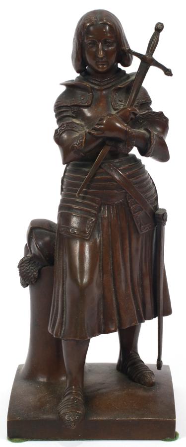 AFTER PRINCESS MARIE D'ORLEANS BRONZE SCULPTURE: AFTER PRINCESS MARIE D'ORLEANS (FRENCH, 1813–1839) BRONZE SCULPTURE, 19TH C. H 9", W 4", JEANNE D'ARC (JOAN OF ARC) Depicting Joan of Arc displaying her piety by bowing her head whilst clutching the