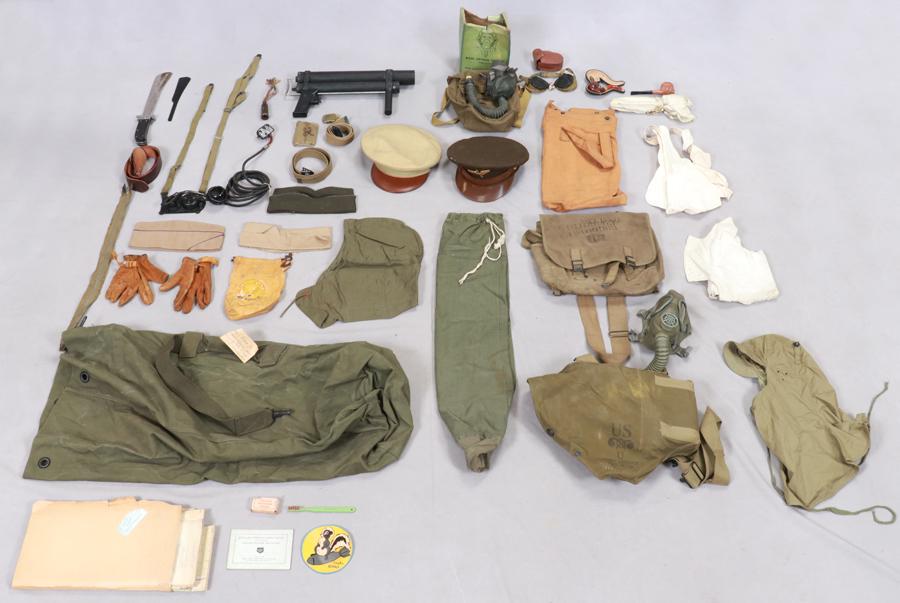 KOREAN WAR MEMORABILIA, 50+ PCS: KOREAN WAR MEMORABILIA, 50+ PCSA collection of Korean War memorabilia. Includes badges, uniform pieces, toiletries, a gas mask and more.