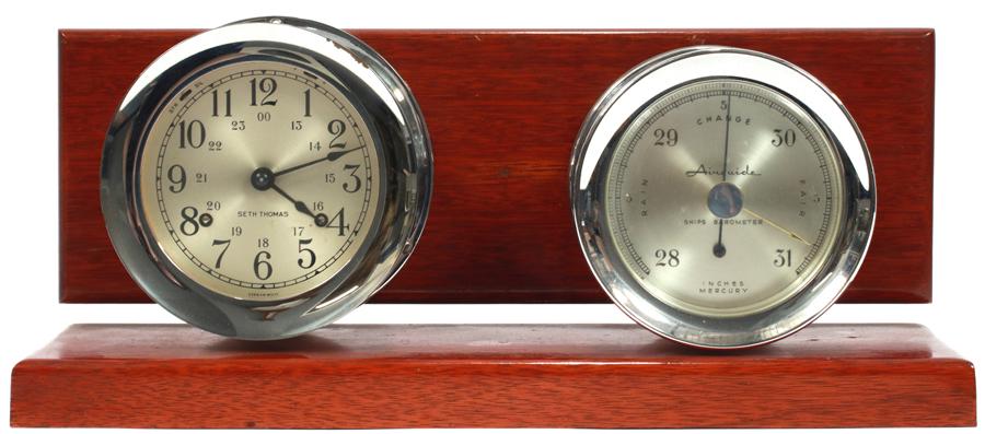 SETH THOMAS SHIP'S CLOCK & BAROMETER, H 7", W 16": SETH THOMAS SHIP'S CLOCK & BAROMETER, H 7", W 16"A vintage Seth Thomas ship's clock and barometer. Having silver tone cases, mounted on lacquered oak. Key included.