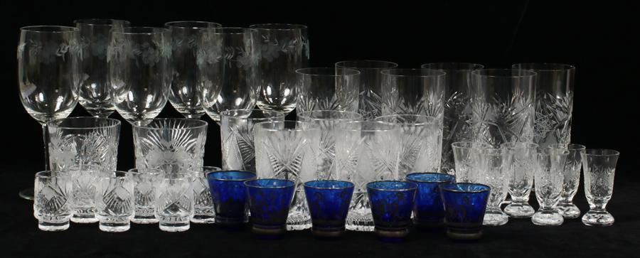 CRYSTAL WINES, HIGHBALLS, TUMBLERS & SHOT GLASSES: CRYSTAL WINES, HIGHBALLS, TUMBLERS & SHOT GLASSES, 37 PCS, H 2"-8"A collection of cut crystal and cobalt stemware. Includes six wines, five highballs, six water glasses, two tumblers, twelve shot glas