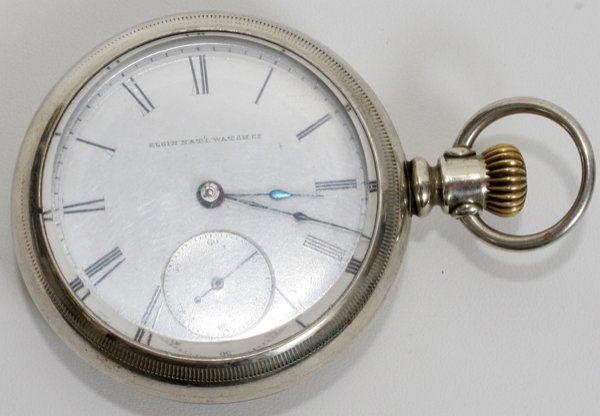 ELGIN NAT'L WATCH CO. POCKET WATCH, 1882-1883: ELGIN NAT'L WATCH CO., POCKET WATCH, CASE MAKER FAHYS #1066412, 1882-1883:Roman numerals, seconds dial at 6 o'clock; silver on copper case; lever set winder; Open face crystal. Nos on case #402, #1201