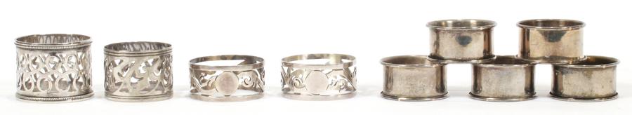 STERLING AND SILVER PLATE NAPKIN RINGS (9): STERLING AND SILVER PLATE NAPKIN RINGS (9) Six are silver plate, three are sterling.From an Arbor Court, Bloomfield Hills estate.