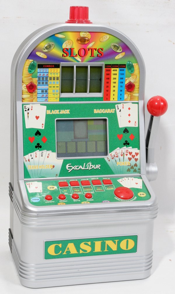 ULT CASINO EXCALIBUR ELEC TOY SLOT MACHINE: ULTIMATE CASINO EXCALIBUR ELECTRONICS TOY SLOT MACHINE MODEL VR07 BATTERY POWERED, 1960'S:Flag of Champion Slots, Texas Hold 'em, Black Jack Jackpot, Draw Poker, Pirate Sea Slots, Baccarat.