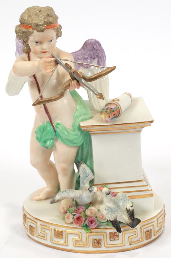 MEISSEN PORCELAIN CHERUB WITH BOW 19TH.C.: MEISSEN PORCELAIN CHERUB WITH BOW 19TH.C. H 7.5", RESTORATION Restored hand and crossbow. Underglaze blue crossed swords mark. Incised numerals #50. Beautifully hand decorated. Good attention to detai
