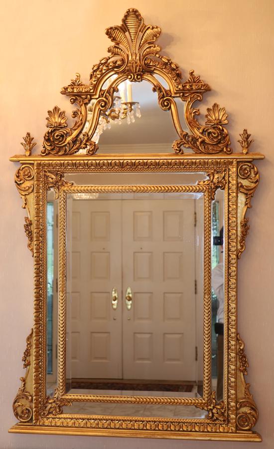 BAROQUE STYLE GILT CARVED WOOD MIRROR, H 60" W 40": BAROQUE STYLE GILT CARVED WOOD MIRROR, H 60" W 40"A Baroque style gilt carved wood mirror. Having leaf carved crest and scrolling leaf carvings throughout. From a stately Dakota Circle, Bloomfield Hil