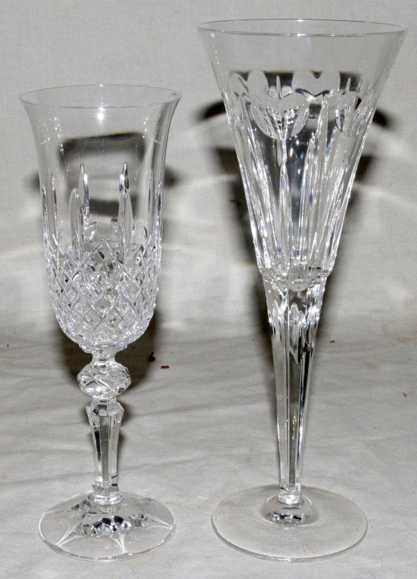 WATERFORD & WATERFORD STYLE CHAMPAGNE FLUTES: WATERFORD & WATERFORD STYLE CRYSTAL CHAMPAGNE FLUTES, NINE PIECES, H 8 1/4" - 9 1/4":Including 5 unmarked champagne flutes, H. 8 1/4", Dia. 2 3/4" together with 4 champagne flutes from the Waterford '