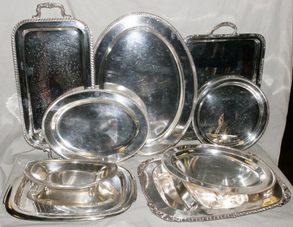SILVER PLATE TRAYS, NINE PIECES: "SILVER PLATE TRAYS, NINE PIECES:Trays including one footed H 2"", L 13"", one round Dia 12"", two oval L16"", one Well and Tree L 19 3/4"", W 14 1/2"", one large oval L 22"", W16 1/4"" plus three oth