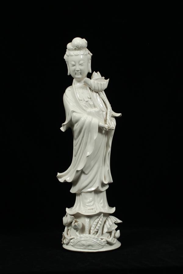 PORCELAIN GUAN YIN FIGURINE, H 20", DIA 6": PORCELAIN GUAN YIN FIGURINE, H 20", DIA 6"A porcelain Guan Yin figurine. Having "Hong Kong" and diamond form marks to the underside over glaze.