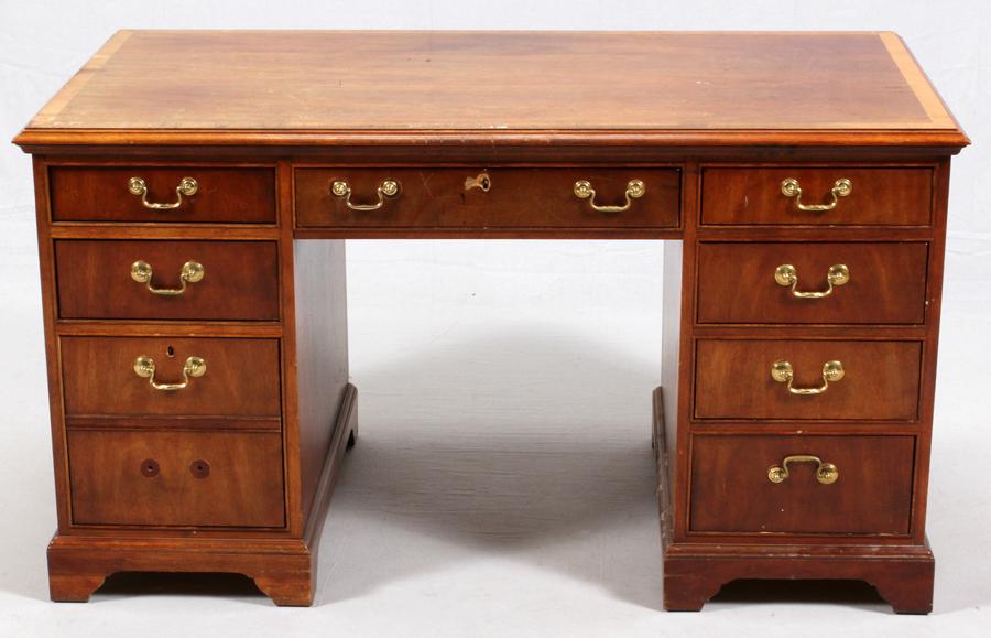 THOMASVILLE MAHOGANY DESK, H 30", L 54', D 28": THOMASVILLE MAHOGANY DESK, H 30", L 54', D 28"A total of 8 drawers, one of which has a two-drawer faux façade. Having brass handles and marked at the interior "Thomasville, The Mahogany Collection".
