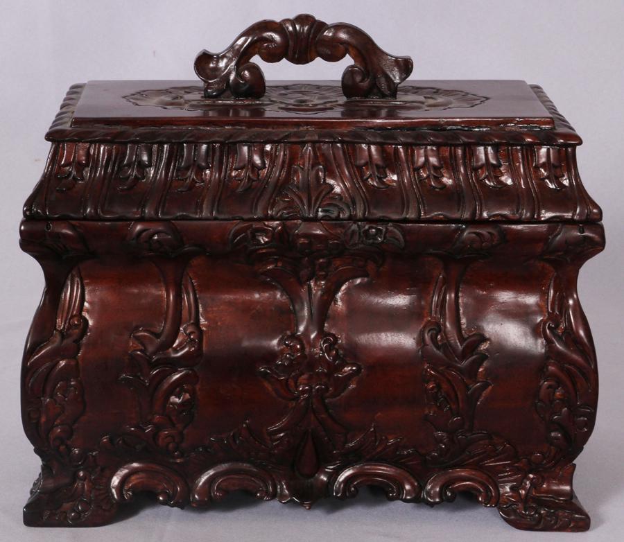 HAND CARVED MAHOGANY COVERED BOX H 11" W 12" D 6": HAND CARVED MAHOGANY COVERED BOX H 11" W 12" D 6" Carved leaf handle on carved mahogany top. Bombe shaped box with scrolling leaf designs.