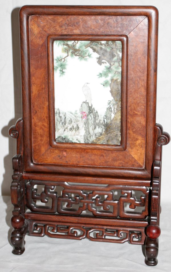 CHINESE PORCELAIN PLAQUE, H 18", L 12": "CHINESE PORCELAIN PLAQUE, H 18"", L 12"":Porcelain panel depicting a perched falcon in a burl wood frame, on wood stand. From the Estate of Robert D. Ellinger, Grand Rapids, MI." (rev.20090319)