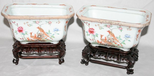 CHINESE PORCELAIN SMALL PLANTERS, H 3 1/2": "CHINESE PORCELAIN SMALL PLANTERS, PAIR, H 3 1/2"", L 7 1/2"":rectangular shape, flared rim and four feet; having bird and floral motif on carved wood stands. Marked china. From the Estate of Robert D