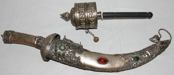 TIBETAN PRAYER WHEEL AND DAGGER 2 PCS.: TIBETAN PRAYER WHEEL AND DAGGER 2 PCS.:Including a Tibetan Buddhist metal and wooden prayer wheel, 1' 10", along with a Tibetan dagger and scabbard with inset hard stones, 1' 19". From the Estate of R