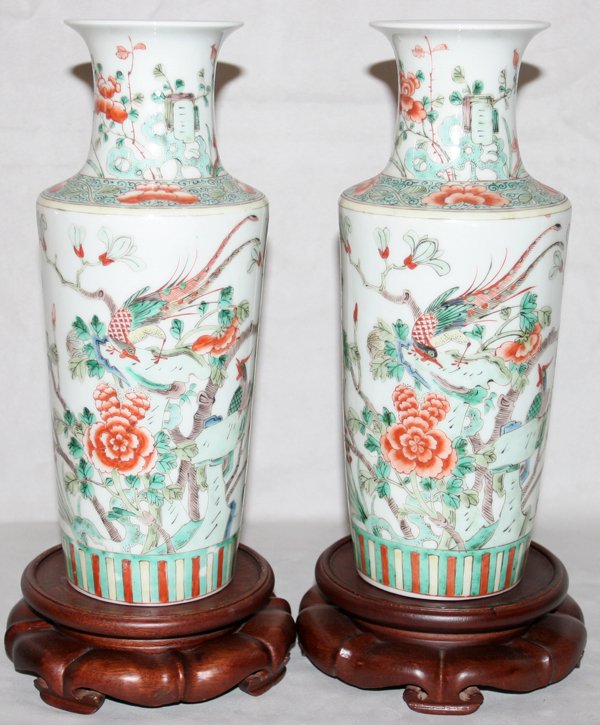 CHINESE PORCELAIN VASES, TWO, H 11", DIA 5": "CHINESE PORCELAIN VASES, TWO, H 11"", DIA 5"":Phoenix bird perched in a flower and branch motif; on a wood base. From the Estate of Robert D. Ellinger, Grand Rapids, MI." (rev.20090319)