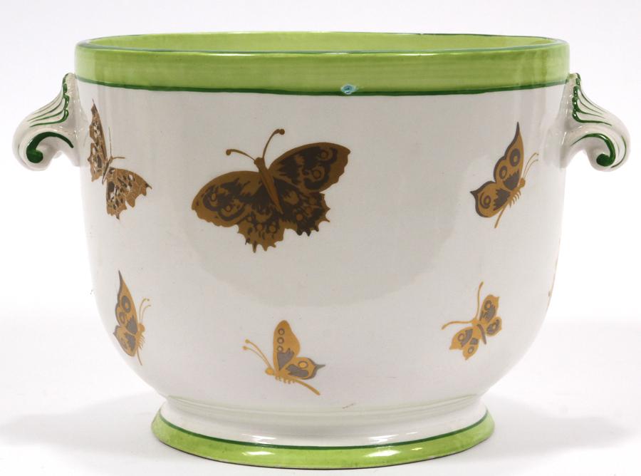MOTTAHEDEH ITALIAN PORCELAIN PLANTER, H 6.5", L 9": MOTTAHEDEH ITALIAN PORCELAIN PLANTER, H 6.5", L 9"Having a green rim, butterfly motif and scroll form handles.From the Estate of George Palmer, Seminole Street, Indian Village, Mi.