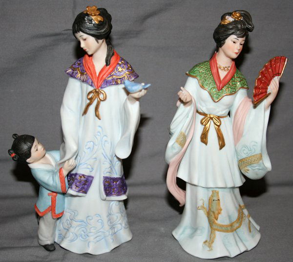CHINESE PORCELAIN FIGURES, 1988, 2 PCS., H 8": CHINESE PORCELAIN FIGURES, 1988, 2 PCS., H 8":depicts young maidens, one with fan, other with child and bird; unglazed;