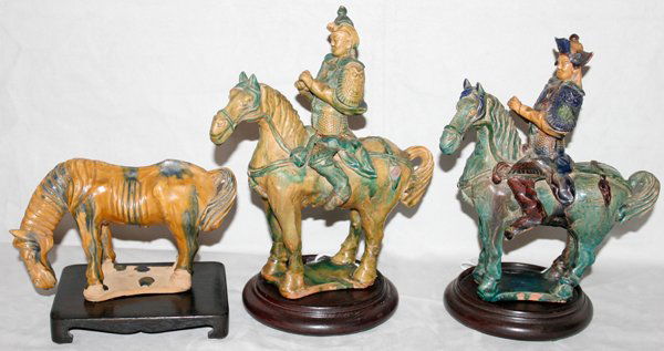 CHINESE EARTHENWARE POTTERY GROUPING, THREE: CHINESE EARTHENWARE POTTERY GROUPING, THREE PIECE:Two figures on horseback, on is "as is", and a figure of a standing horse. 8" x 9" and 5" x 8". On wooden stands. From the Estate of Robert D. Ellinge